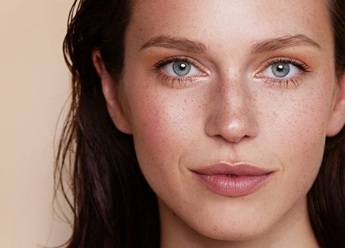 Woman with freckles and clear skin